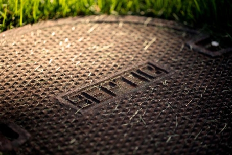 Man hole cover labeled septic